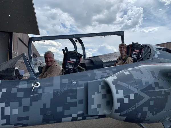 S-211 jet trainer in digital camo on the ramp
