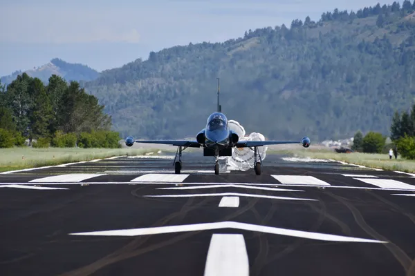 S-211 on rollout with drag chute deployed